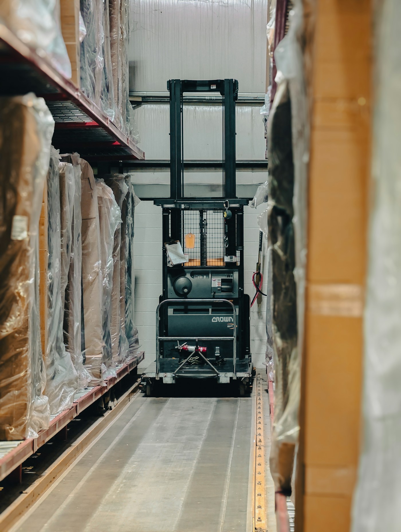 Palletised goods in a warehouse aisle